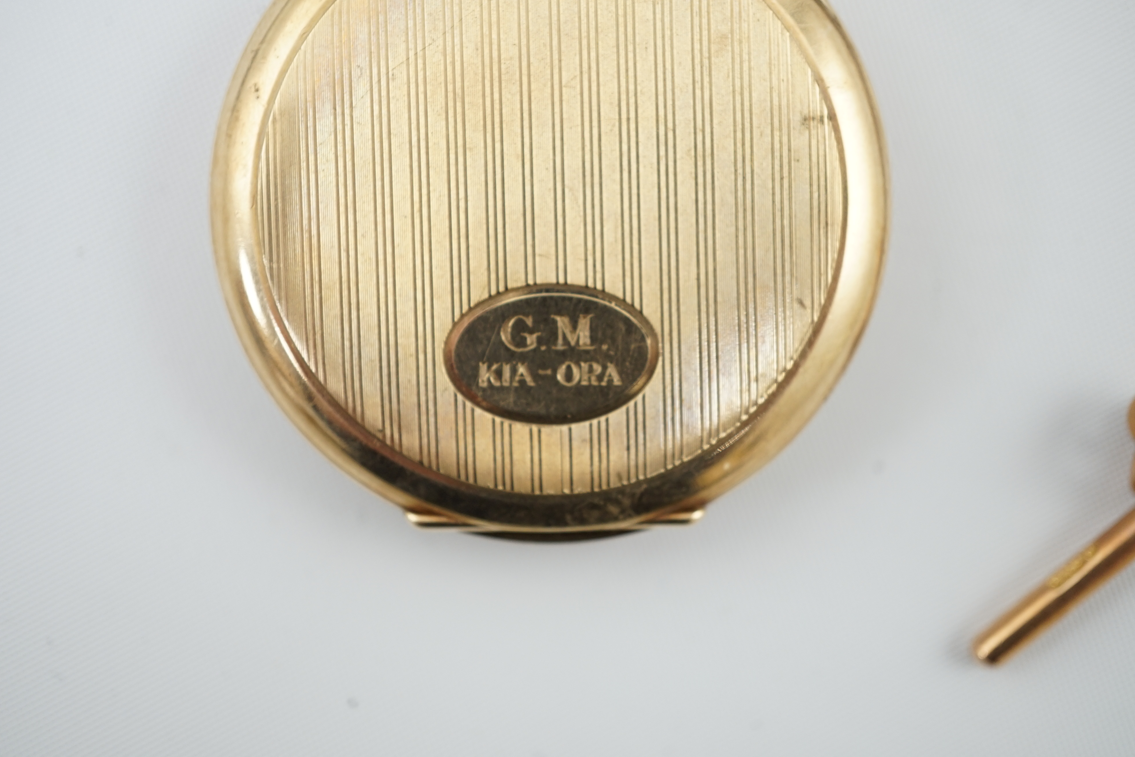 A George V 9ct gold open face dress pocket watch, retailed by William Greenwood & Sons, together with a 9ct gold albert